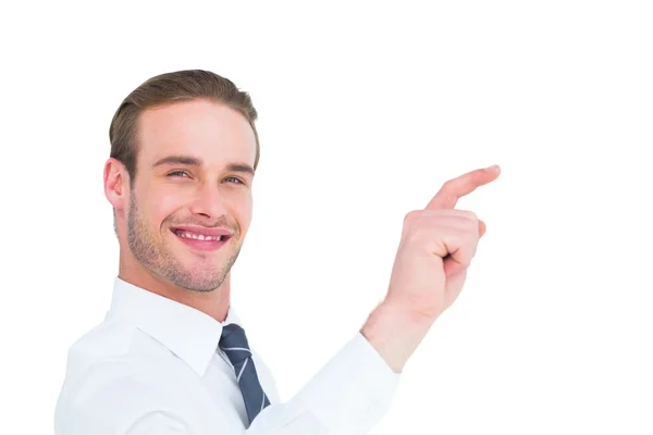 Smiling businessman pointing with his finger — Stock Photo, Image