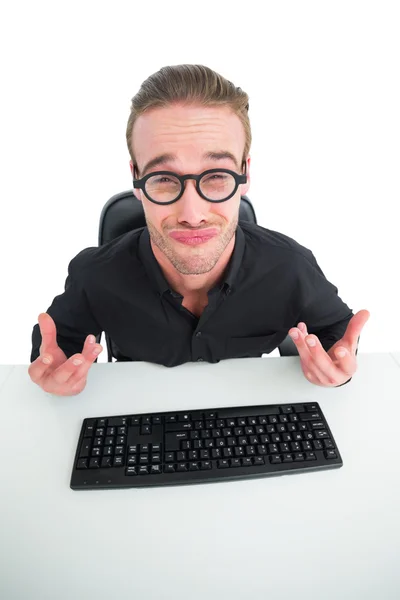 Businessman with reading glasses making a face — Stock Photo, Image