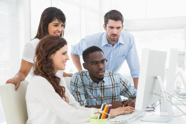 Concentrated coworkers using computer — Stock Photo, Image