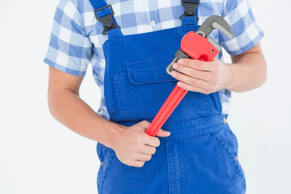 Repairman holding adjustable pliers — Stock Photo, Image