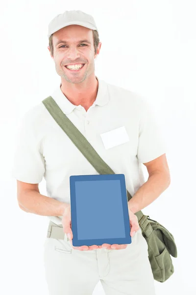Smiling delivery man showing digital tablet — Stock Photo, Image