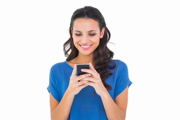 Pretty brunette sending a text — Stock Photo, Image