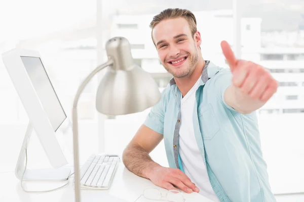 Businessman smiling with thumb up — Stock Photo, Image