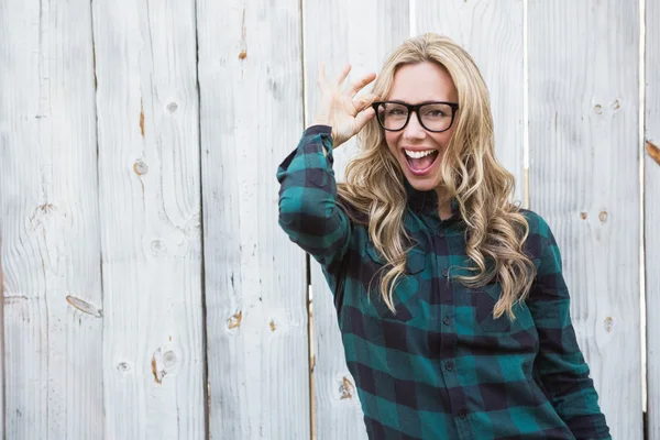 Blonde with hand on her glasses posing — Stock Photo, Image