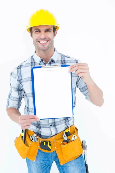 Confident carpenter holding clip board — Stock Photo, Image