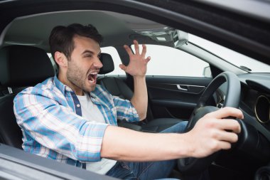 Young man experiencing road rage clipart