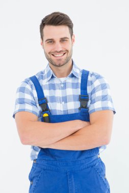Male handyman standing arms crossed clipart