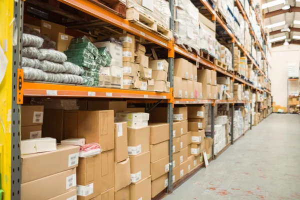 Shelves with boxes in warehouse — Stock Photo, Image