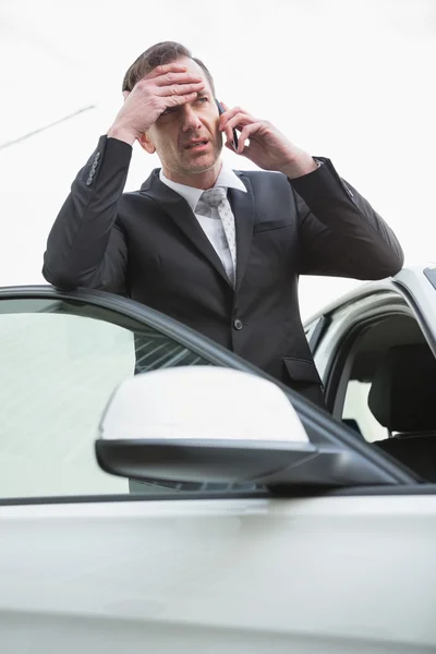 Nervous businessman on the phone — Stock Photo, Image