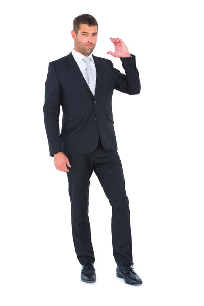 Uomo d'affari sorridente con la mano alzata — Foto Stock
