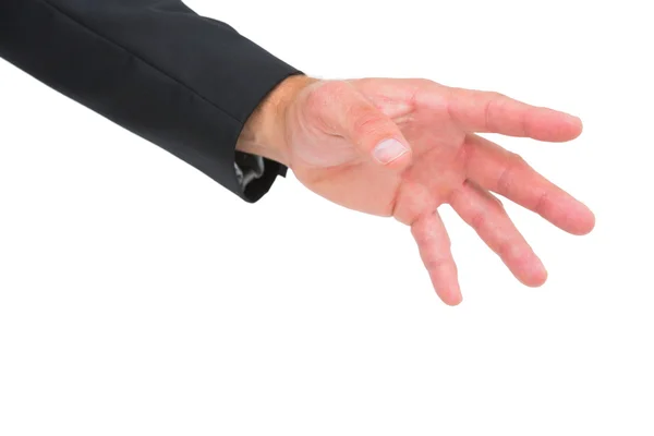 Businessman holding hand out — Stock Photo, Image