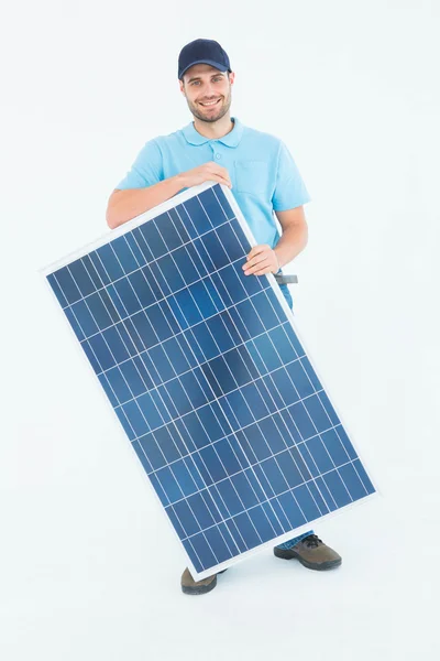 Construction worker holding solar panel — Stock Photo, Image