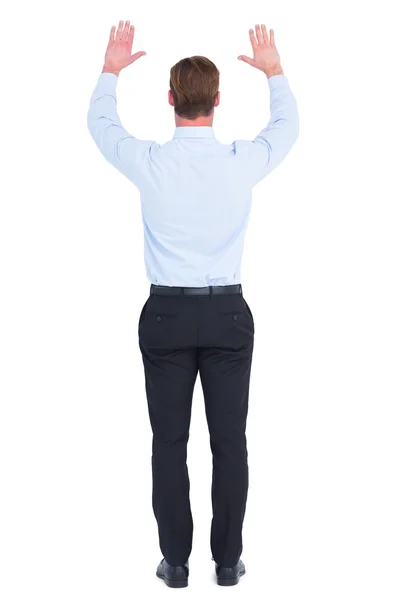 Rear view of businessman with hands up — Stock Photo, Image