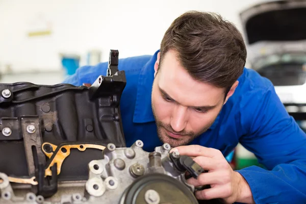 Mechanic working on an engine — Stock Photo, Image