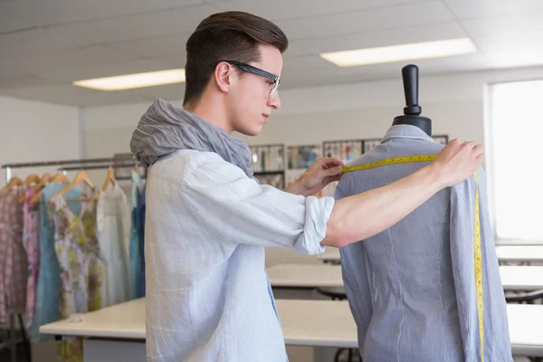 Fashion student working on mannequin — Stock Photo, Image