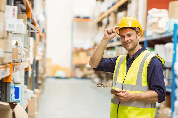 Portrait of warehouse worker with clipboard — Stock Photo, Image