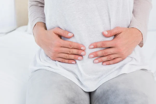 Woman with stomach pain — Stock Photo, Image