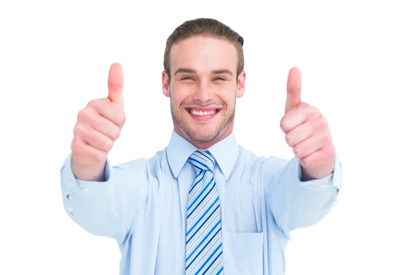 Positive businessman smiling with thumbs up — Stock Photo, Image