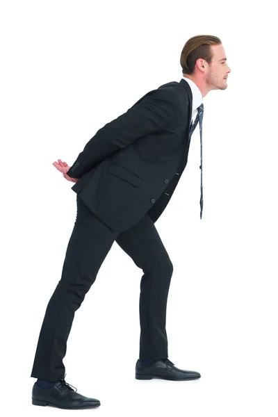 Businessman in suit leaning over — Stock Photo, Image