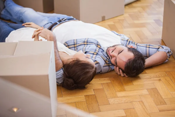 Cute couple lying on the floor — Stock Photo, Image