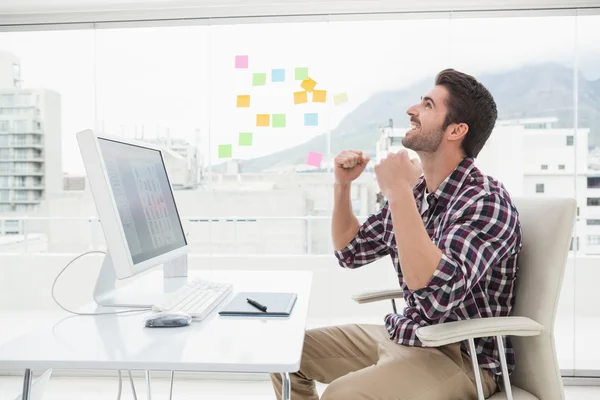 Happy casual businessman cheering — Stock Photo, Image