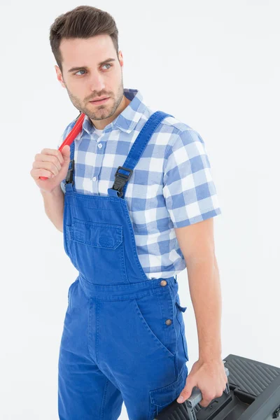 Repairman carrying toolbox — Stock Photo, Image