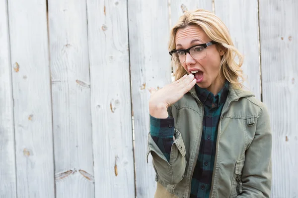 Shocked blonde in glasses gesturing — Stock Photo, Image