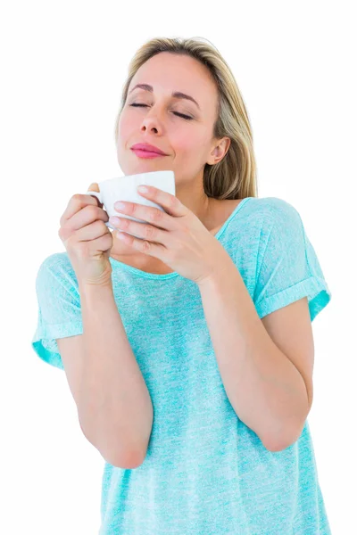 Blonde with hot beverage relaxing — Stock Photo, Image