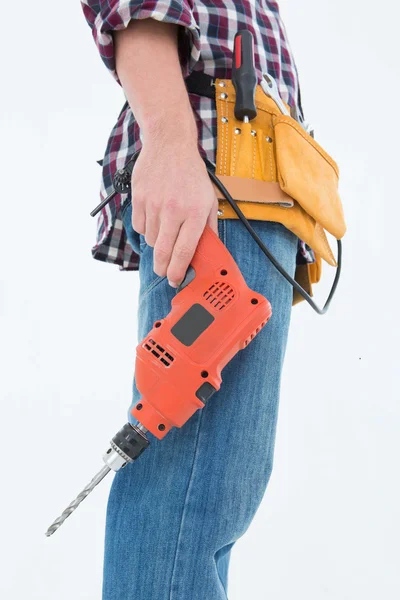 Male handyman holding drill machine — Stock Photo, Image