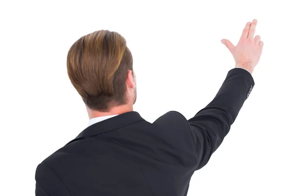 Rear view of businessman pointing with his fingers — Stock Photo, Image