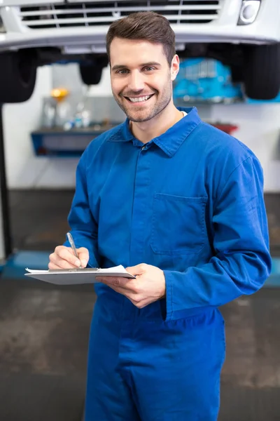 Smiling mechanic looking at camera — Stock Photo, Image