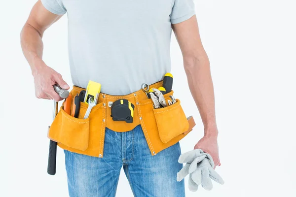 Technician holding gloves and hammer — Stock Photo, Image