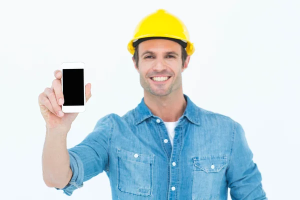 Happy carpenter showing smart phone — Stock Photo, Image