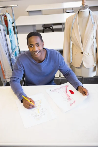 Smiling university student drawing picture — Stock Photo, Image