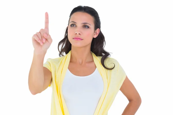 Pretty brunette pointing — Stock Photo, Image