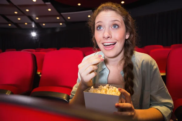 Young woman watching a film — Stock Photo, Image