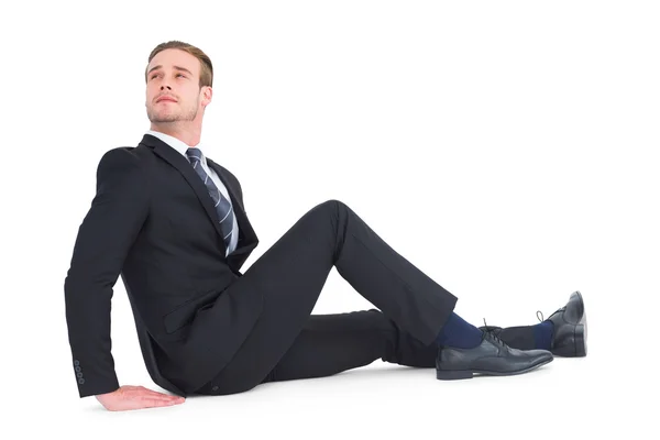 Businessman sitting and looking up — Stock Photo, Image