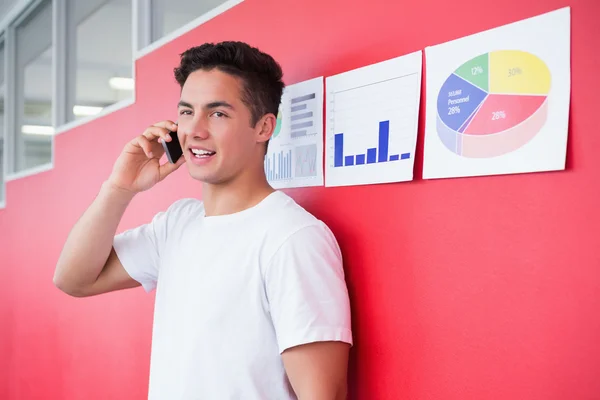 Smiling student on the phone standing — Stock Photo, Image