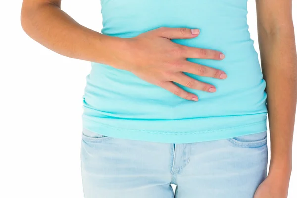 Slim woman with hand on stomach — Stock Photo, Image