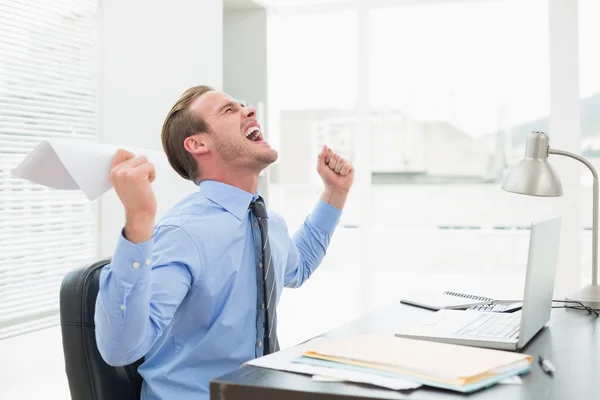 Businessman holding document cheering — Stock Photo, Image