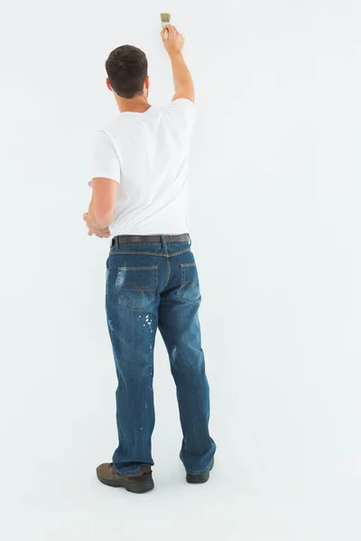 Rear view of man painting — Stock Photo, Image