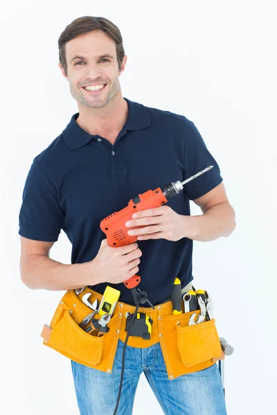 Carpenter holding portable drill machine — Stock Photo, Image