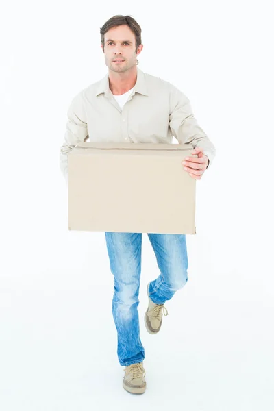 Delivery man carrying cardboard box — Stock Photo, Image