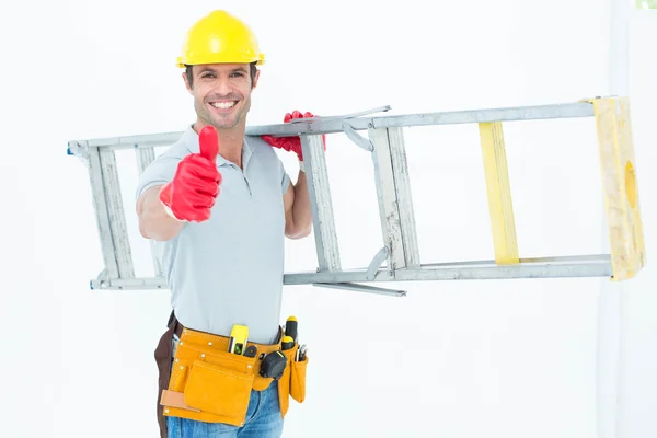 Worker carrying step ladder — Stock Photo, Image