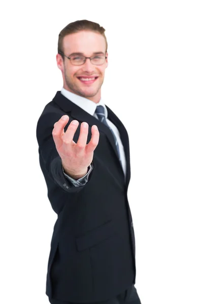 Businessman holding out his hand — Stock Photo, Image