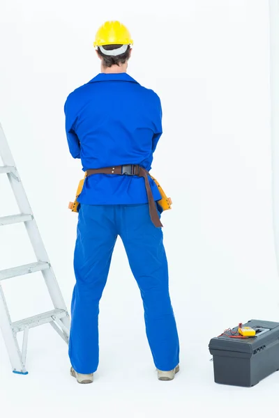 Rear view of electrician standing — Stock Photo, Image