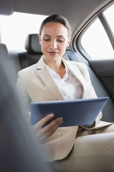 Pretty businesswoman using her tablet pc — Stock Photo, Image
