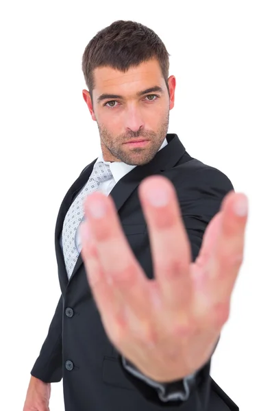Businessman holding out his hand — Stock Photo, Image