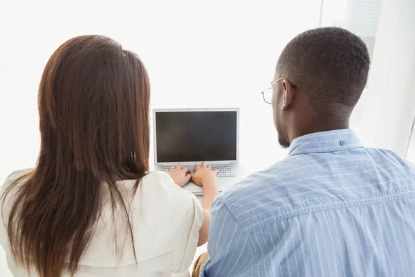 Coworkers using laptop — Stock Photo, Image