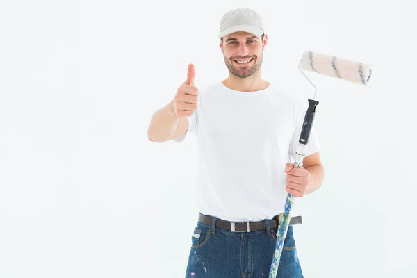 Happy man with paint roller — Stock Photo, Image